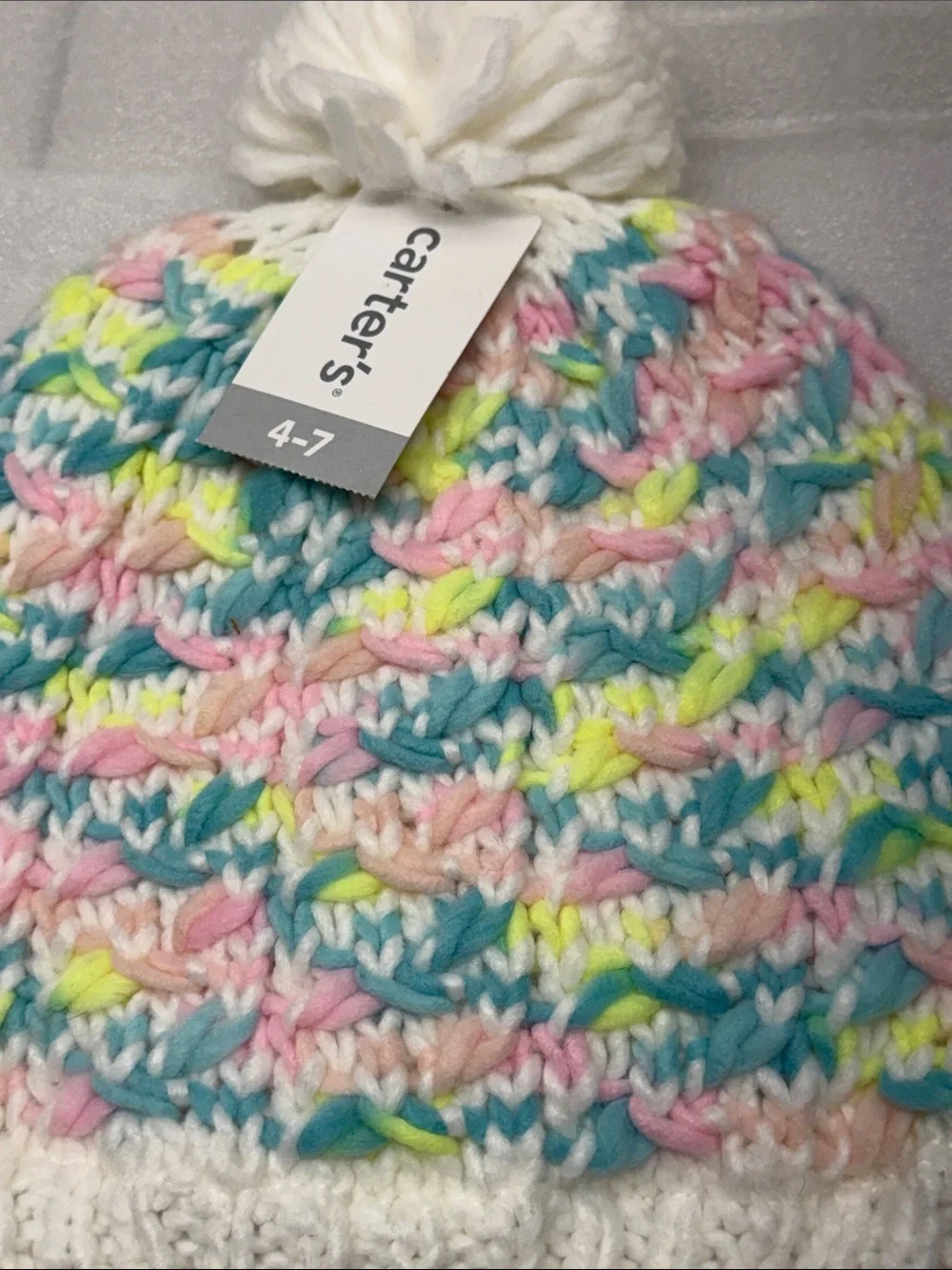 Carter's White Pom-Pom Beanie with Pastel Pink, Blue, Yellow and Mint Stripes